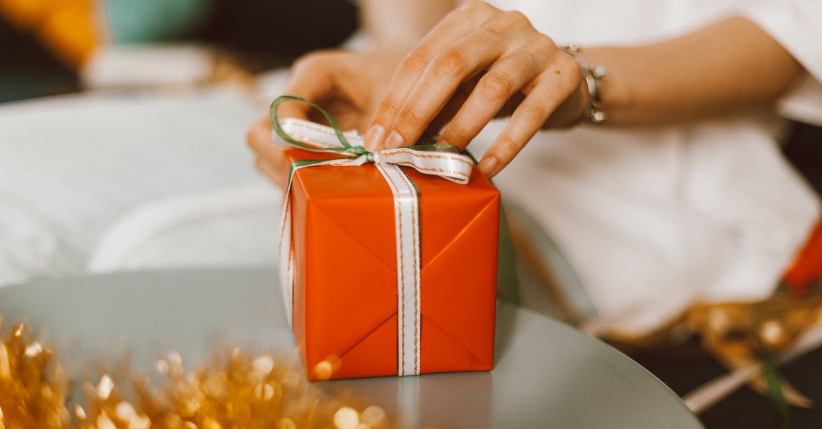 Does a minor need to be present to apply for a passport in Colombia? [closed] - Person Holding Red Gift Box
