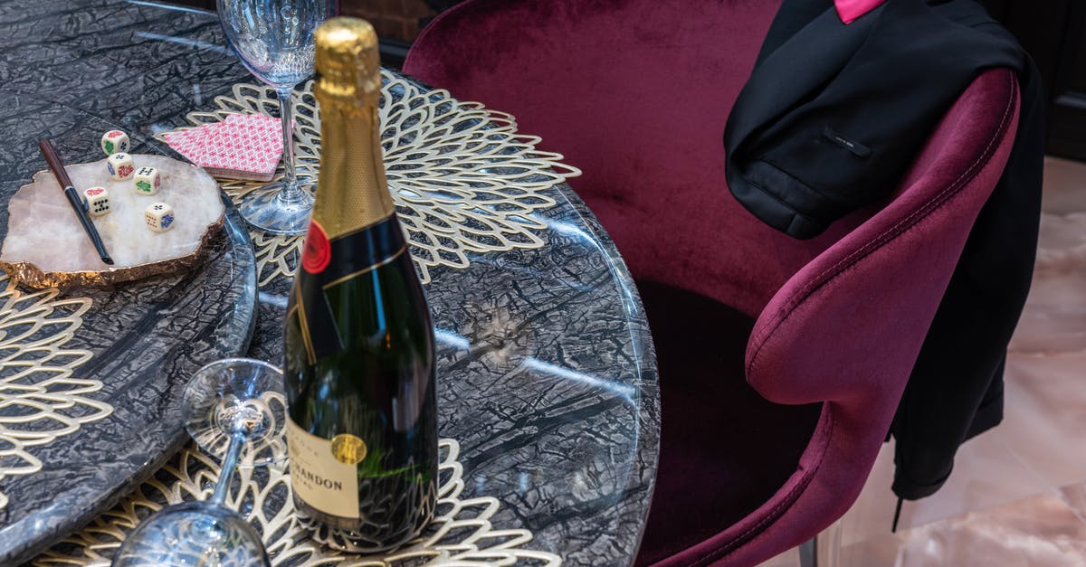Does a PR card holder of Canada require transit visa in Amsterdam? [duplicate] - Bottle of champagne between glasses on table
