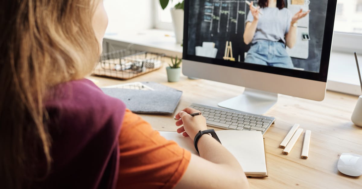Does an Egyptian student resident in the EU need a visa for a short stay in Switzerland? [duplicate] - Photo of Girl Watching Through Imac