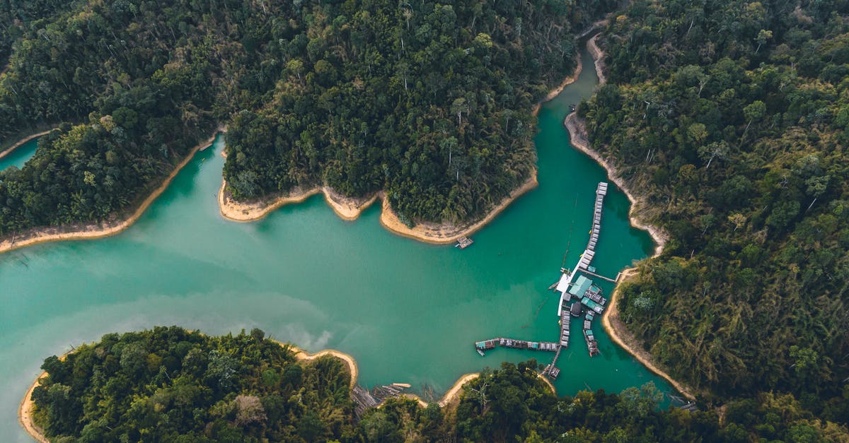 Does anyone know where this beach is located? - Breathtaking drone view of houses on water and sandy coastline surrounded by exotic forest and lagoon Does anyone know where this beach is located? - Breathtaking drone view of houses on water and sandy coastline surrounded by exotic forest and lagoon