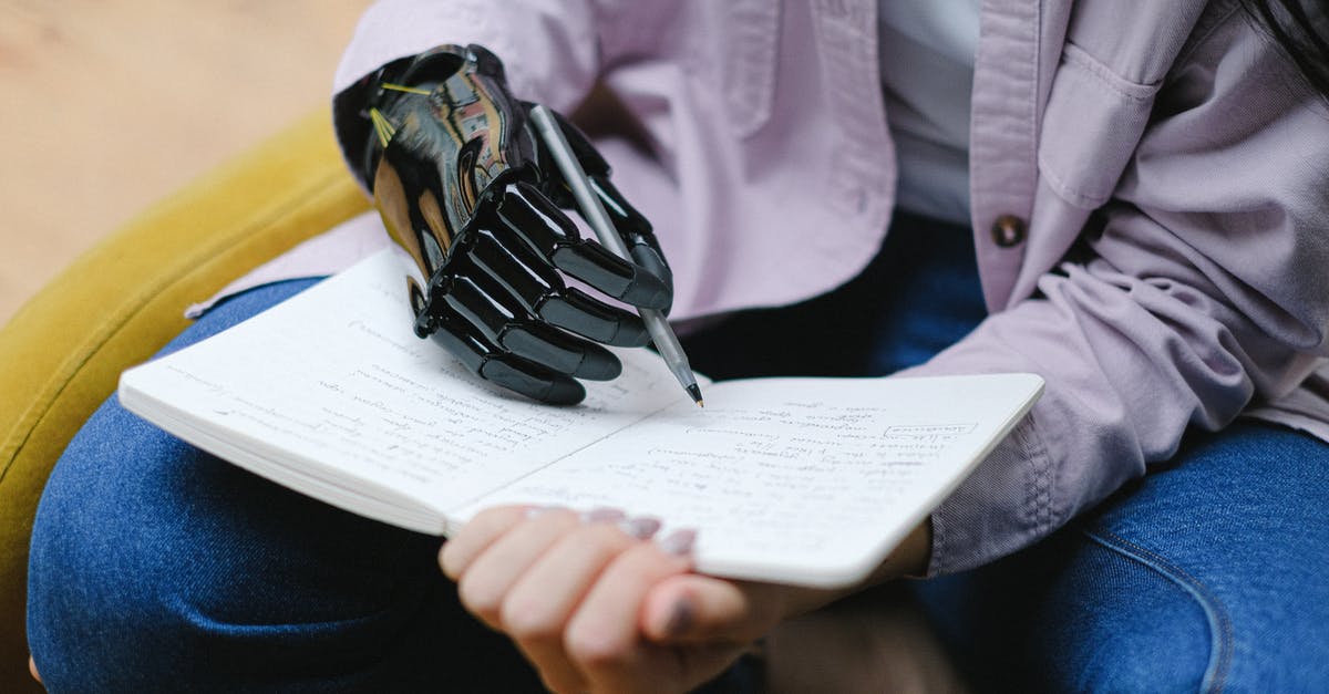 Does Automatic Revalidation work for F2 visas? - Woman with modern prosthesis of hand writing in notebook Does Automatic Revalidation work for F2 visas? - Woman with modern prosthesis of hand writing in notebook