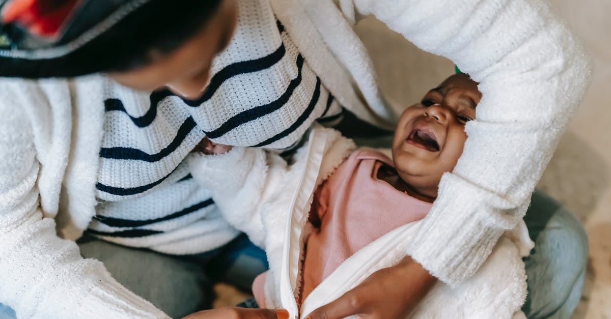 Does changing latitude affect sleep? - A Mother Changing Her Baby's Clothes Does changing latitude affect sleep? - A Mother Changing Her Baby's Clothes