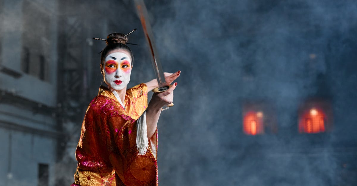 Does female sword fighting as entertainment still exist in Japan? - A Woman in a Kimono Holding a Sword Does female sword fighting as entertainment still exist in Japan? - A Woman in a Kimono Holding a Sword