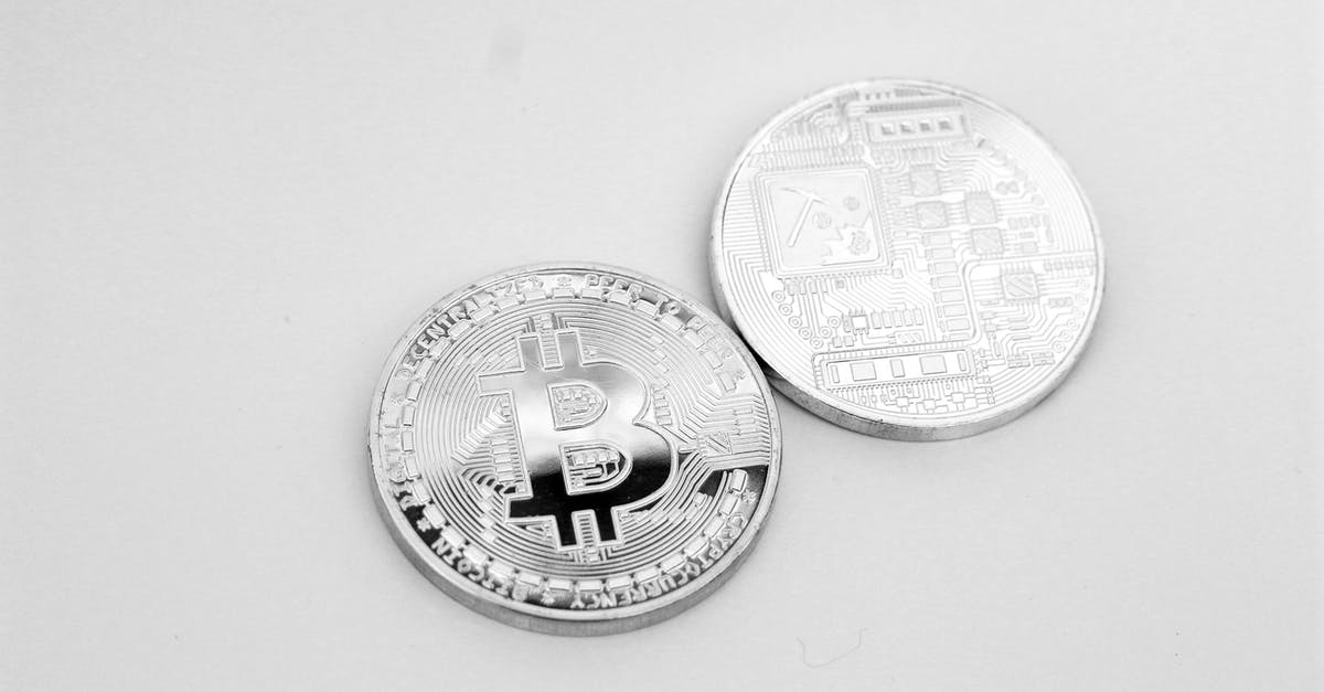 Does Icelandair board front to back or back to front? - Silver Round Coins on White Surface Does Icelandair board front to back or back to front? - Silver Round Coins on White Surface