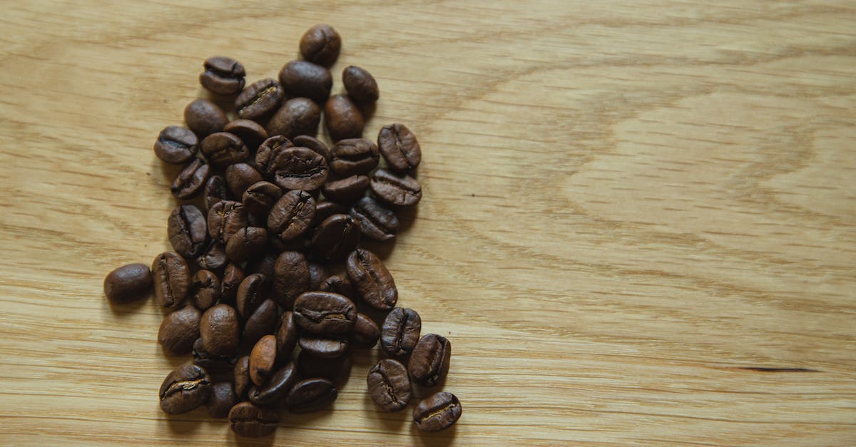 Does it make more sense to stay in Lido or Venice? [closed] - Top view of scattered coffee beans placed on wooden table before making coffee