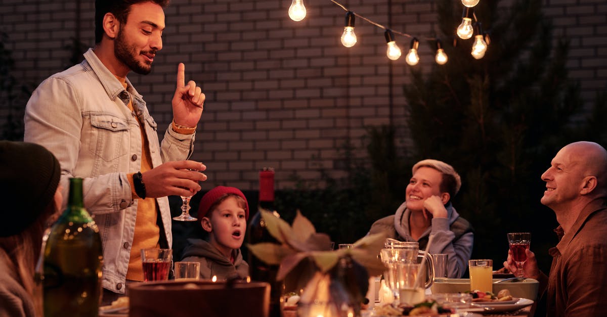 Does Madrid's metro offer children's fares? - Ethnic guy offering toast at dinner with friends Does Madrid's metro offer children's fares? - Ethnic guy offering toast at dinner with friends