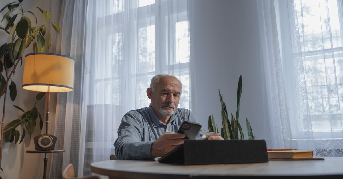 Does MasterCard work in Italy? - A Low Angle Shot of an Elderly Man Using His Mobile Phone Does MasterCard work in Italy? - A Low Angle Shot of an Elderly Man Using His Mobile Phone