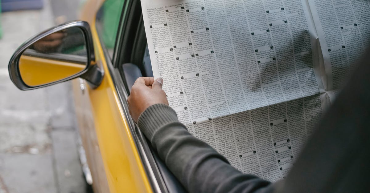 Does my duty free allowance stack with other people in my car to Canada? - Person reading newspaper sitting in car Does my duty free allowance stack with other people in my car to Canada? - Person reading newspaper sitting in car