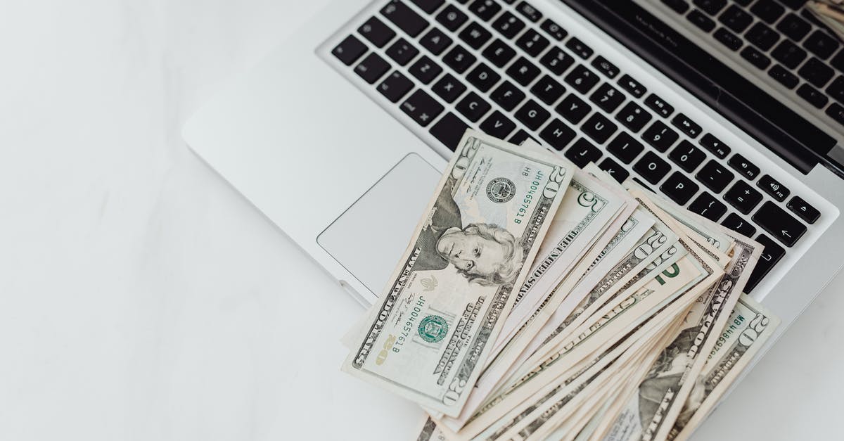 Does my proof of funds for my UK visa need to be in a proper savings account? Can it be in a second checking account? - Close-Up Photo of Banknotes on Top of a Laptop's Keyboard Does my proof of funds for my UK visa need to be in a proper savings account? Can it be in a second checking account? - Close-Up Photo of Banknotes on Top of a Laptop's Keyboard