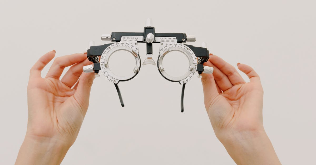 Does occupation show on a one visa affect your chances of getting visa for another country? - Crop unrecognizable female demonstrating modern trial frame with optical lenses against white background in optometrist studio
