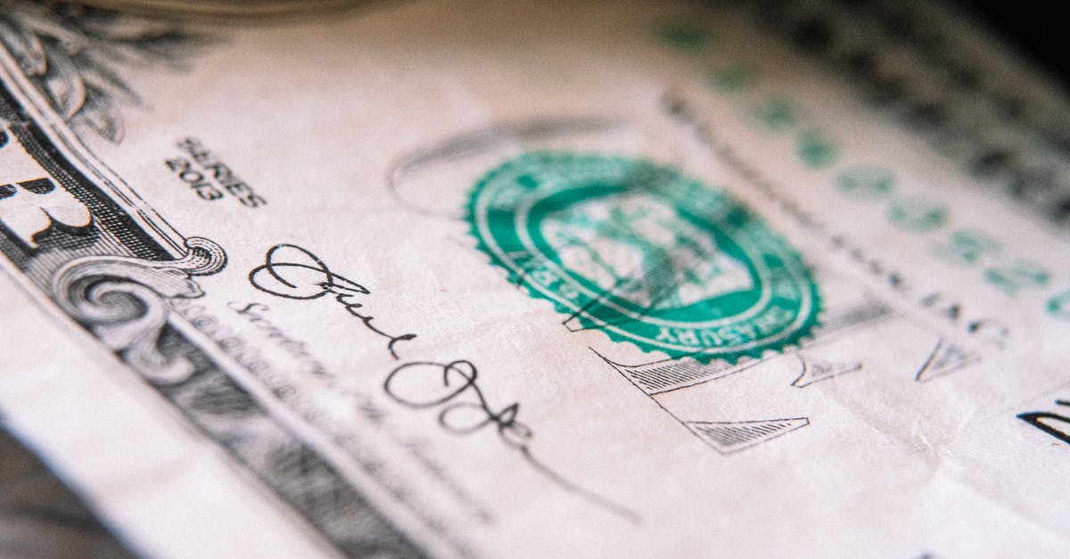 Does one need cash in Australia? - From above closeup one US dollar bill placed on table with front side up Does one need cash in Australia? - From above closeup one US dollar bill placed on table with front side up