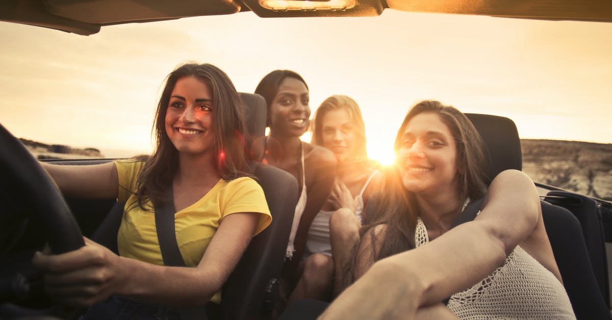 Does renting a car to explore Palawan make sense? - Photo Of Women Sitting On Car Does renting a car to explore Palawan make sense? - Photo Of Women Sitting On Car
