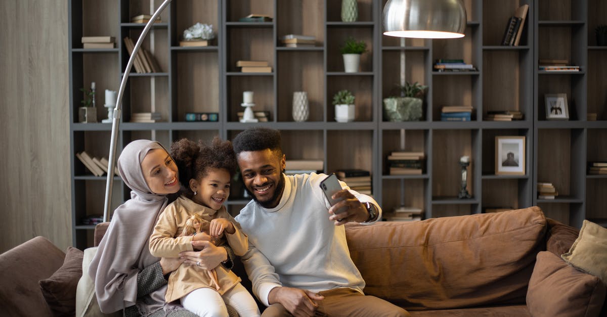 Does Ryanair accept the image of the boarding pass on a mobile phone? - Delighted multiethnic family taking selfie sitting on couch Does Ryanair accept the image of the boarding pass on a mobile phone? - Delighted multiethnic family taking selfie sitting on couch