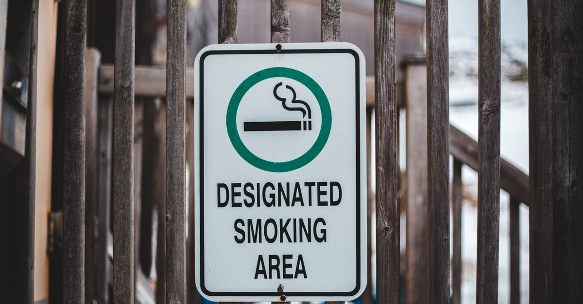 Does Ryanair allow rucksack? - Sign with cigarette in green circle allowing to smoke in designated area hanging on wooden fence Does Ryanair allow rucksack? - Sign with cigarette in green circle allowing to smoke in designated area hanging on wooden fence