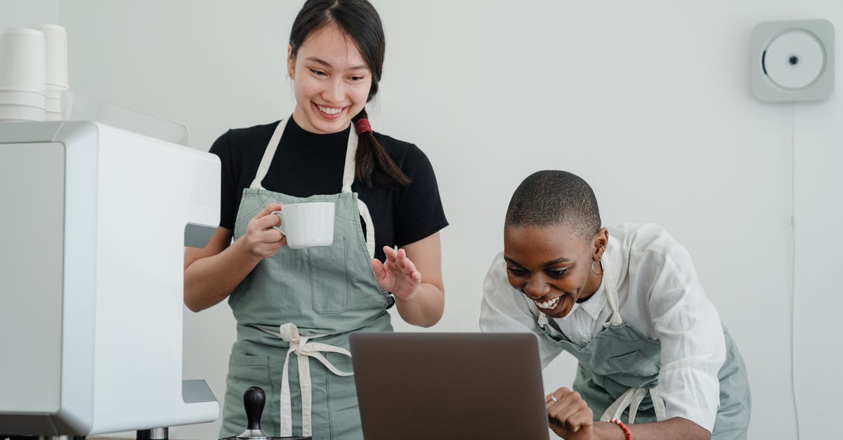 Does StarAlliance's loyality program have a "recommend a friend" program? - Cheerful multiracial female baristas using modern laptop during coffee break Does StarAlliance's loyality program have a "recommend a friend" program? - Cheerful multiracial female baristas using modern laptop during coffee break