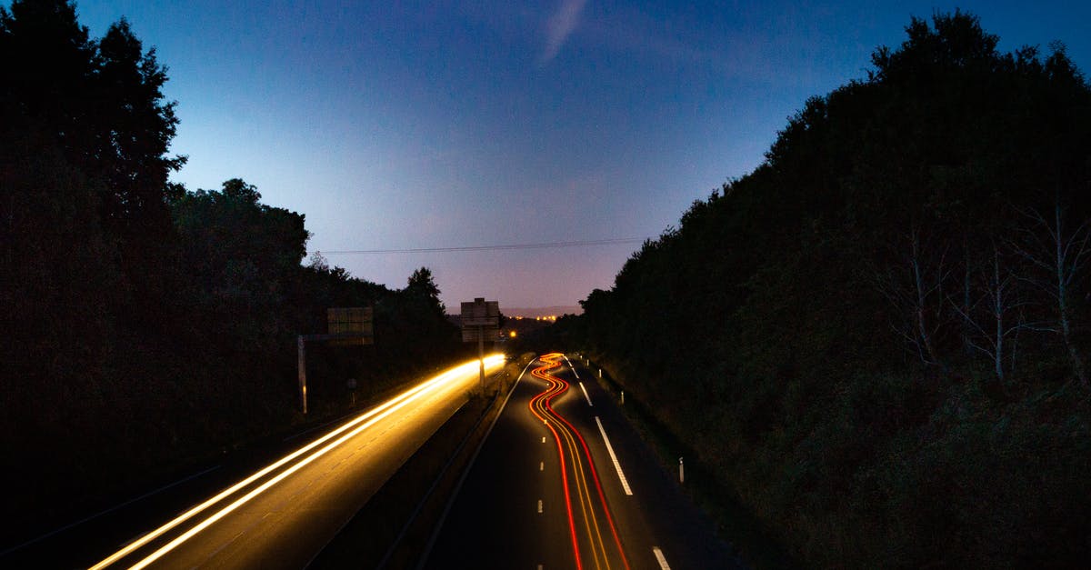 Does the introduction of paid fast lane as replacement of the carpool lane increase or decrease the traffic speed? [closed] - Cars on Road during Night
