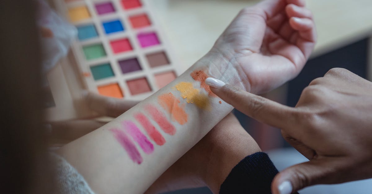 Does the negative PCR test 'EU list of safe countries' exemption apply to travellers with a layover in a third country? - From above of crop unrecognizable young female makeup artist pointing at arm of client while applying colorful eyeshadows on wrist for testing Does the negative PCR test 'EU list of safe countries' exemption apply to travellers with a layover in a third country? - From above of crop unrecognizable young female makeup artist pointing at arm of client while applying colorful eyeshadows on wrist for testing