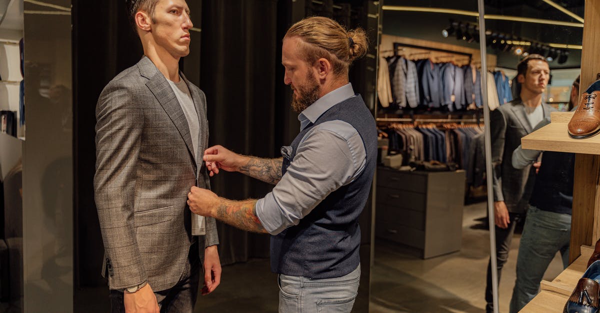 Does the Savoy theatre London allow shopping bags in the theatre? - Man in Gray Suit Jacket Standing Beside Man in Gray Suit Does the Savoy theatre London allow shopping bags in the theatre? - Man in Gray Suit Jacket Standing Beside Man in Gray Suit