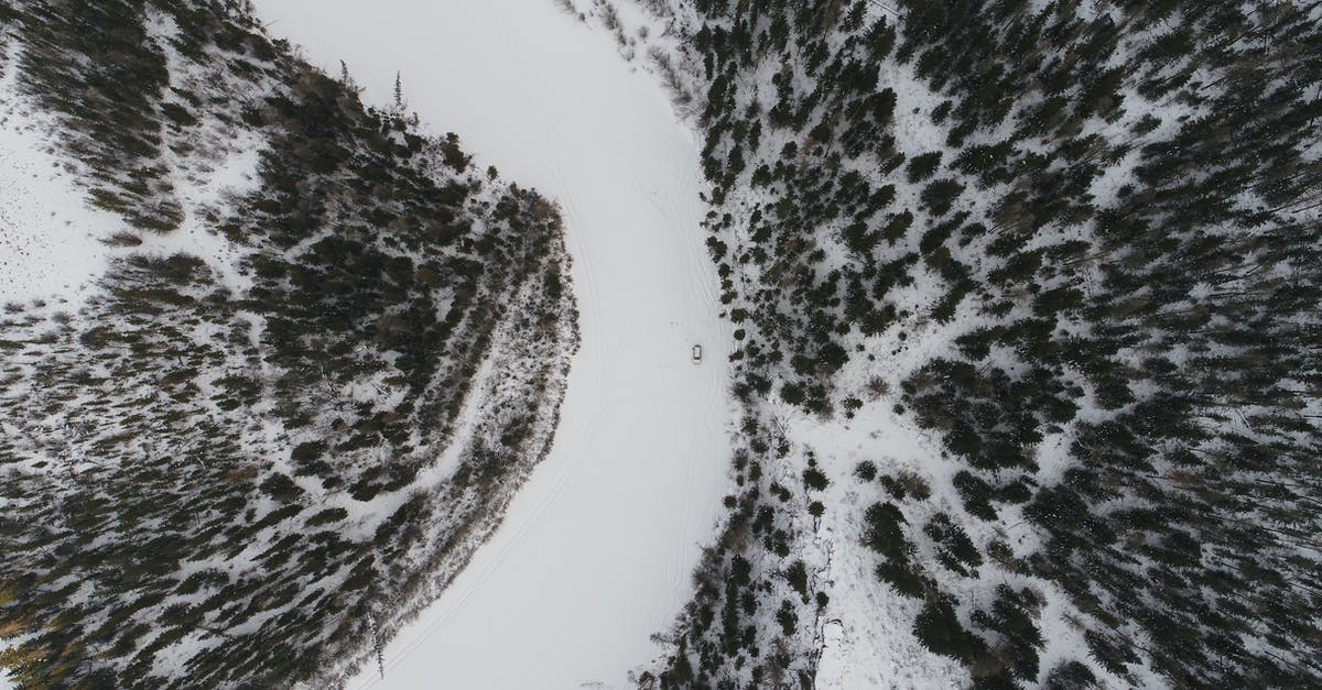 Does trip insurance cover hurricanes? - Car riding on frozen river among firs Does trip insurance cover hurricanes? - Car riding on frozen river among firs