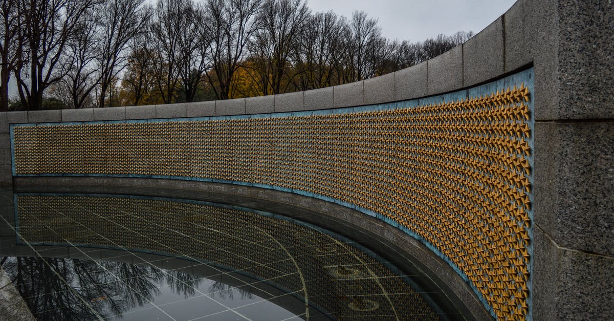 Does US National traveling from UK to Republic of Ireland by bus have to visit immigration for stamp [duplicate] - Golden stars on Freedom Wall at World War II Memorial located in in National Mall in Washington DC against gloomy sky