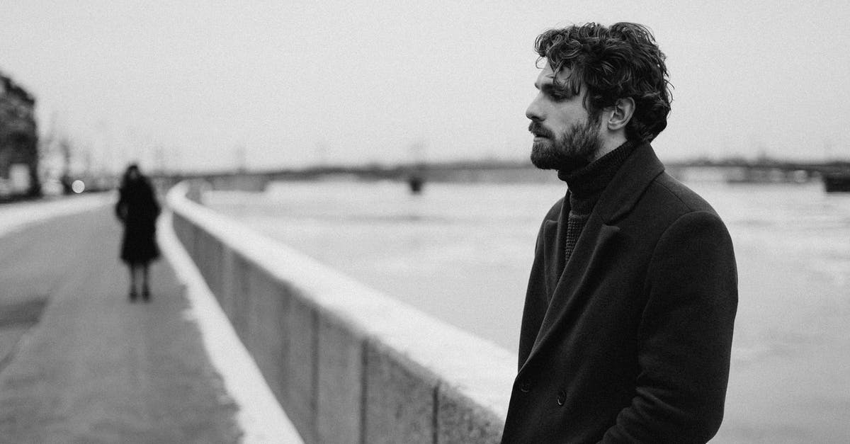 Does wearing imperial beard in the UK attract any ire of general public? - Black And White Photography on Man in Black Coat