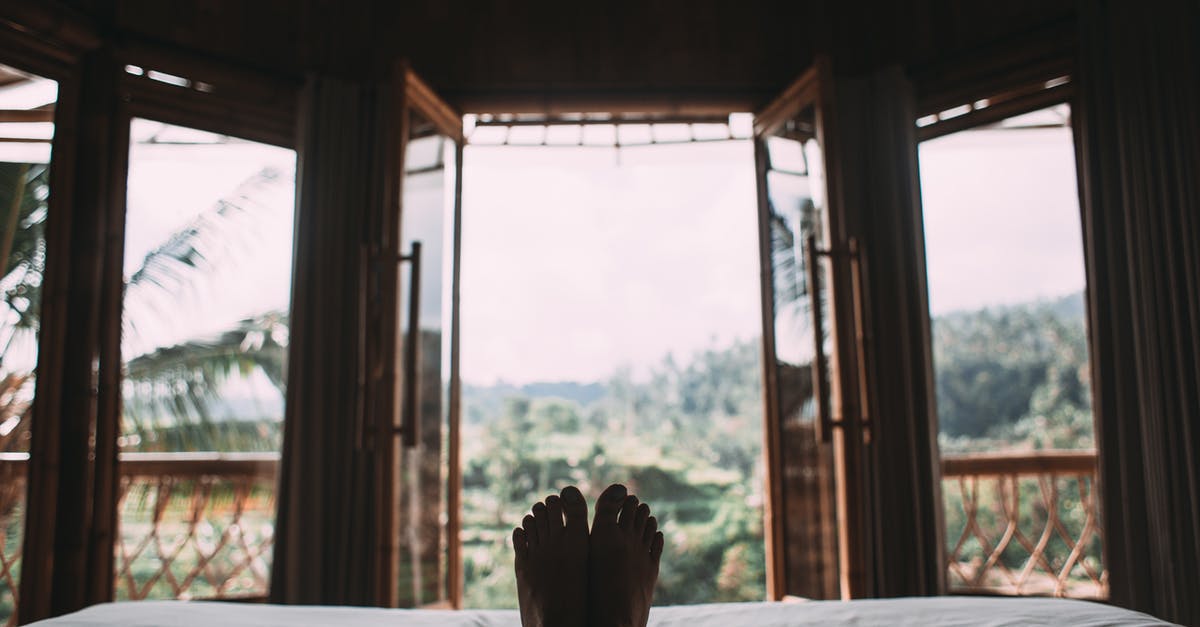 Domestic travel with ID not containing surname - Faceless person resting on bed in room Domestic travel with ID not containing surname - Faceless person resting on bed in room