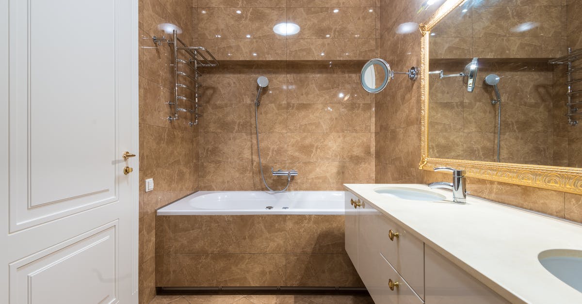 Double entry visa - Bathroom interior with bathtub and sinks under mirror Double entry visa - Bathroom interior with bathtub and sinks under mirror