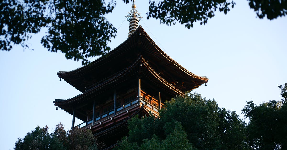 Double-entry visa procedure for transit in Japan - Brown and White Pagoda Temple Surrounded by Green Trees Double-entry visa procedure for transit in Japan - Brown and White Pagoda Temple Surrounded by Green Trees
