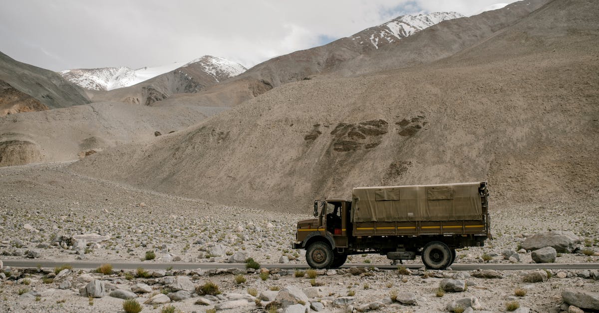 Drive to Chimney Rock - Truck riding on road in mountainous terrain Drive to Chimney Rock - Truck riding on road in mountainous terrain