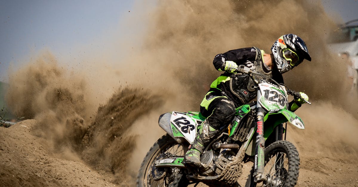 Driving a 125 ccm motorcycle in Spain with EU licence - Rider Riding Green Motocross Dirt Bike Driving a 125 ccm motorcycle in Spain with EU licence - Rider Riding Green Motocross Dirt Bike