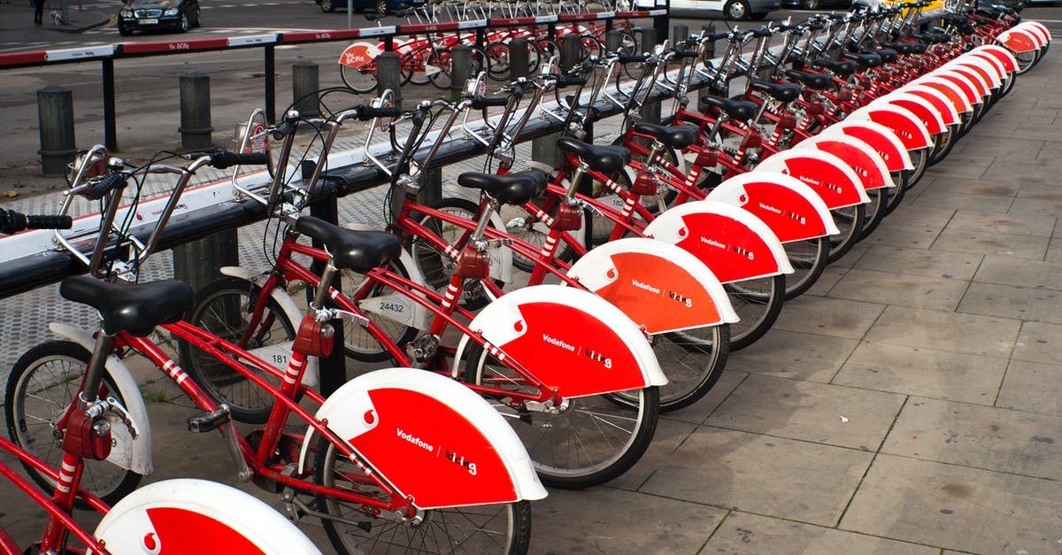 Driving a rental car through Colorado - Parked Red and White Bicycles Driving a rental car through Colorado - Parked Red and White Bicycles