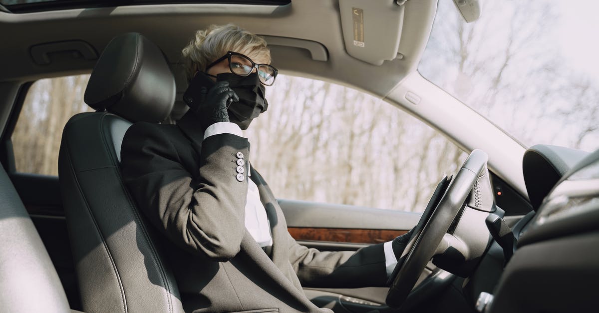 Driving from Haines Alaska to Anchorage Does having a felony (Domestic Violence) 15 years ago prevent me from entering and exiting Canada? - From below side view of unrecognizable woman in formal clothes and protective mask and gloves talking on cellphone while driving contemporary car Driving from Haines Alaska to Anchorage Does having a felony (Domestic Violence) 15 years ago prevent me from entering and exiting Canada? - From below side view of unrecognizable woman in formal clothes and protective mask and gloves talking on cellphone while driving contemporary car
