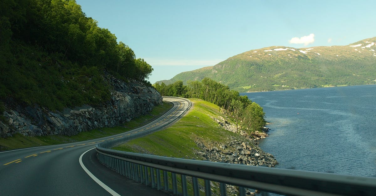Driving in Norway with a US driving license - Concrete Road Near Body Of Water Driving in Norway with a US driving license - Concrete Road Near Body Of Water