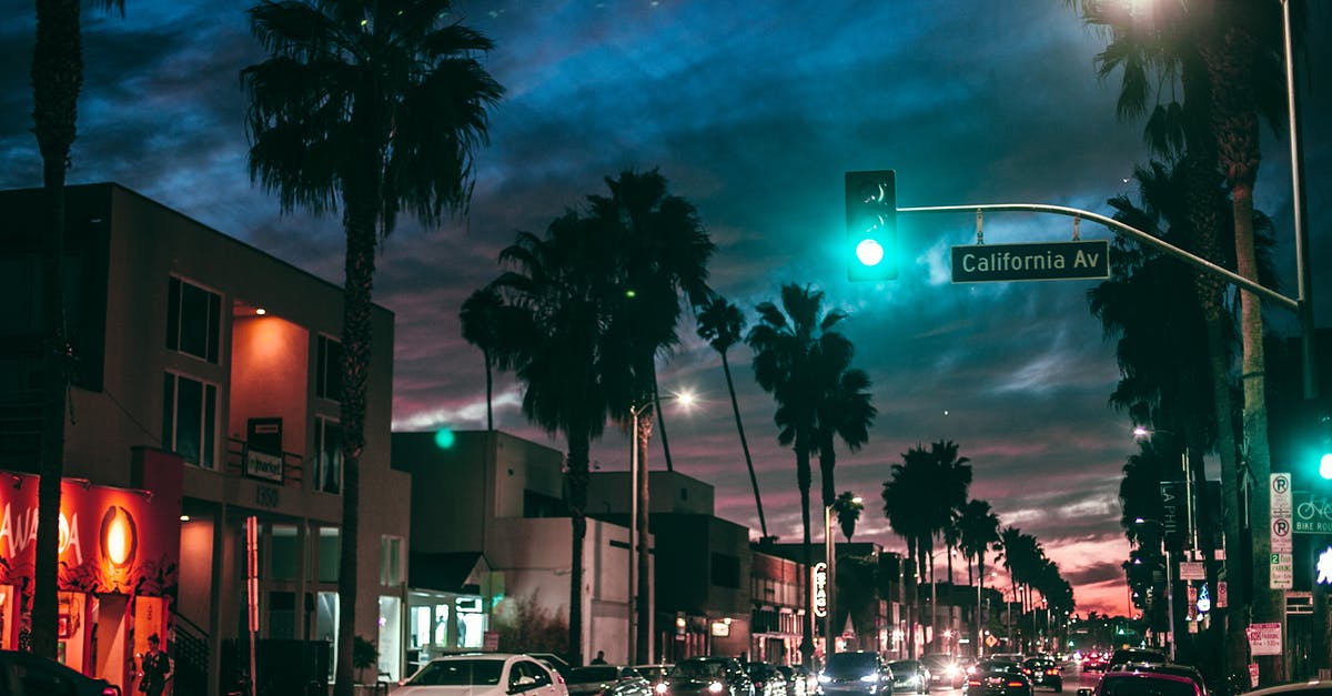 Driving license for electric bikes in California? - Busy city street in tropical town at night Driving license for electric bikes in California? - Busy city street in tropical town at night