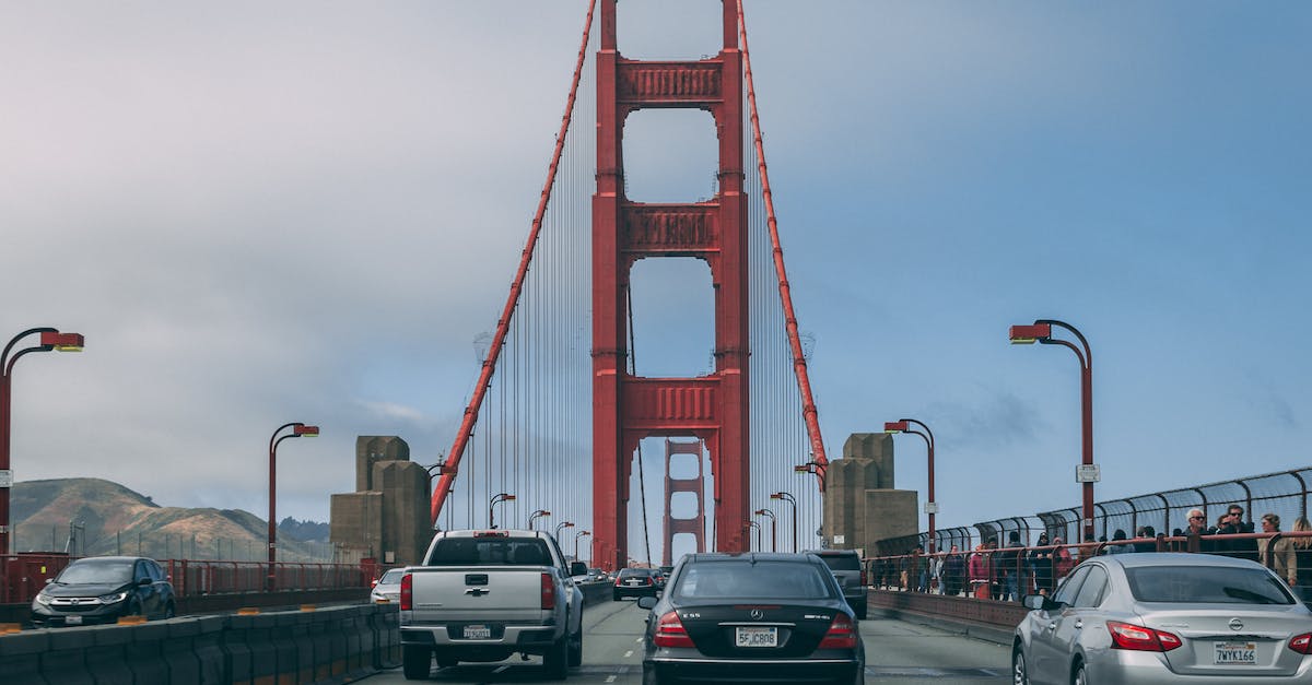 Driving license in California - Cars on Golden Gate Bridge Under Cloudy Sky Driving license in California - Cars on Golden Gate Bridge Under Cloudy Sky