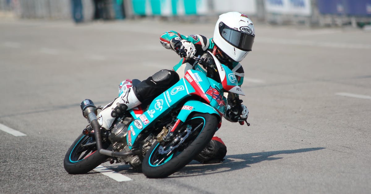 Driving to Yellowknife, NT - Biker Riding a Teal Sport Bike Driving to Yellowknife, NT - Biker Riding a Teal Sport Bike