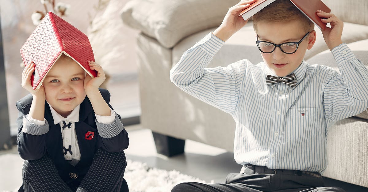 DS-160 - B1/B2 visa - Work/Education/Training - How to fill the section as full-time employee and part-time student [closed] - Smiling little students in formal clothes gathering on floor near sofa and playing games with textbooks while studying together at home