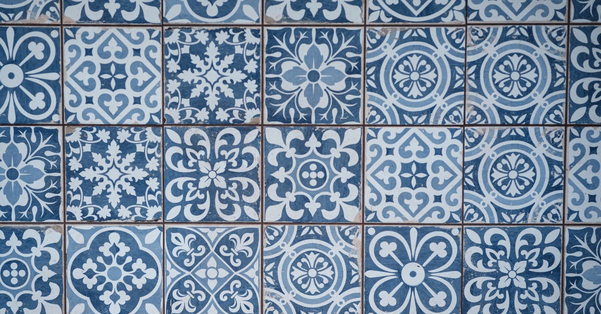 ds-160 - how can I include 2 different types of old visas? - Aged wall covered with ceramic square shaped tile with many blue different ornaments ds-160 - how can I include 2 different types of old visas? - Aged wall covered with ceramic square shaped tile with many blue different ornaments