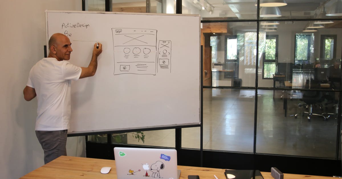 DS-160 Present work/ education/ training information - Professional businessman explaining strategy in office DS-160 Present work/ education/ training information - Professional businessman explaining strategy in office