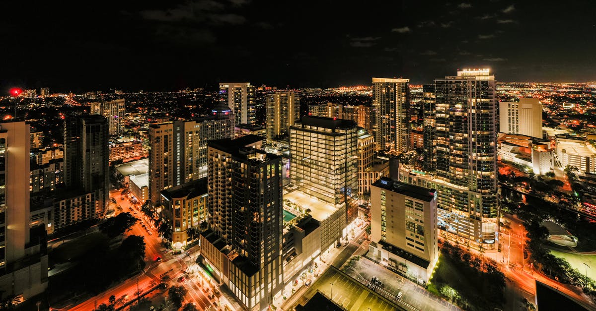 Dublin-Newark-Fort Lauderdale with United - Drone view of illuminated glass skyscrapers in financial district of Fort Lauderdale against night sky Dublin-Newark-Fort Lauderdale with United - Drone view of illuminated glass skyscrapers in financial district of Fort Lauderdale against night sky