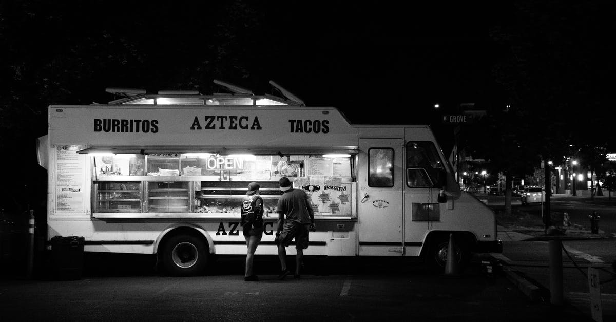 Early-morning food at Népliget bus station in Budapest? - Grayscale Photograph of Two People Standing in Front of Food Truck Early-morning food at Népliget bus station in Budapest? - Grayscale Photograph of Two People Standing in Front of Food Truck