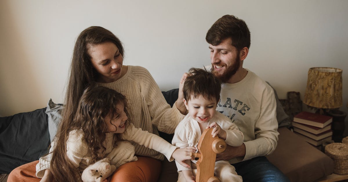 Eastbourne/Beachy Head with a toddler - Happy Family Sitting on Sofa Eastbourne/Beachy Head with a toddler - Happy Family Sitting on Sofa