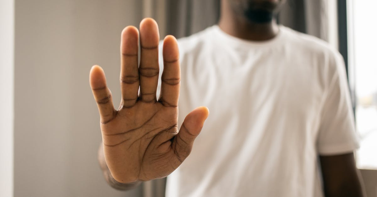 easyJet won't refund because it says 'no-show' but they denied boarding - Unrecognizable black man showing stop gesture easyJet won't refund because it says 'no-show' but they denied boarding - Unrecognizable black man showing stop gesture