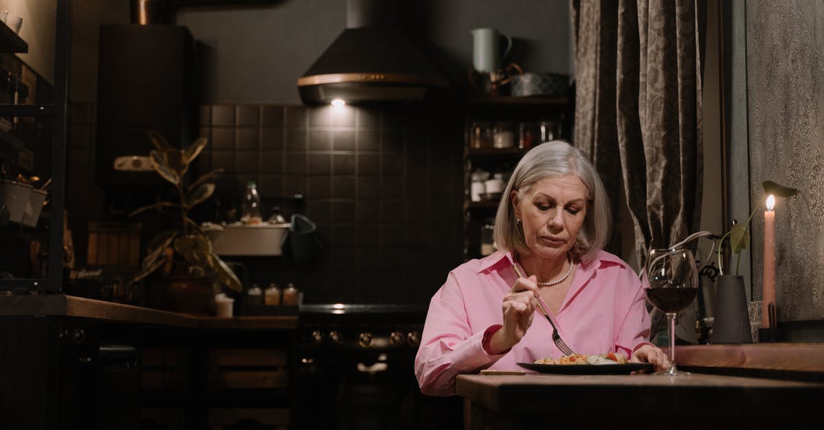 Eating alone in London - An Elderly Woman Eating Alone at Home Eating alone in London - An Elderly Woman Eating Alone at Home