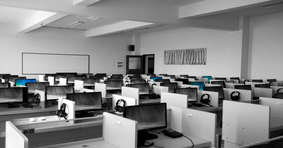 Education background and last employment for the spouse in family application (DS 160) - Gray Wooden Computer Cubicles Inside Room