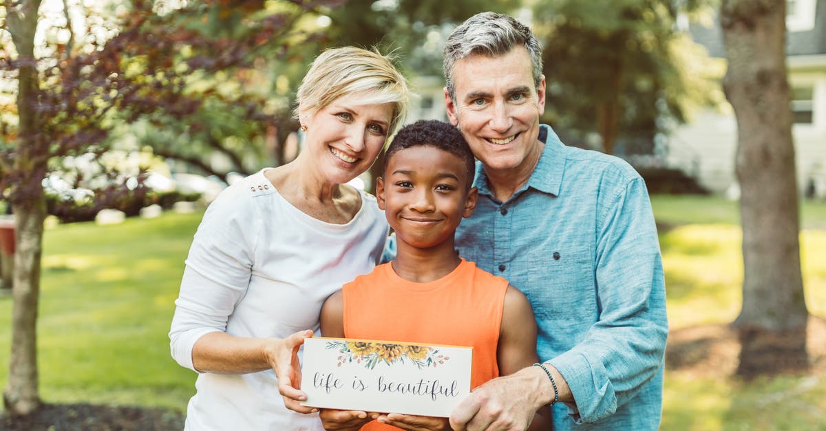 EEA Family Permit "Date of Arrival" Earliest request? - A Family Holding A Sign With Quote EEA Family Permit "Date of Arrival" Earliest request? - A Family Holding A Sign With Quote