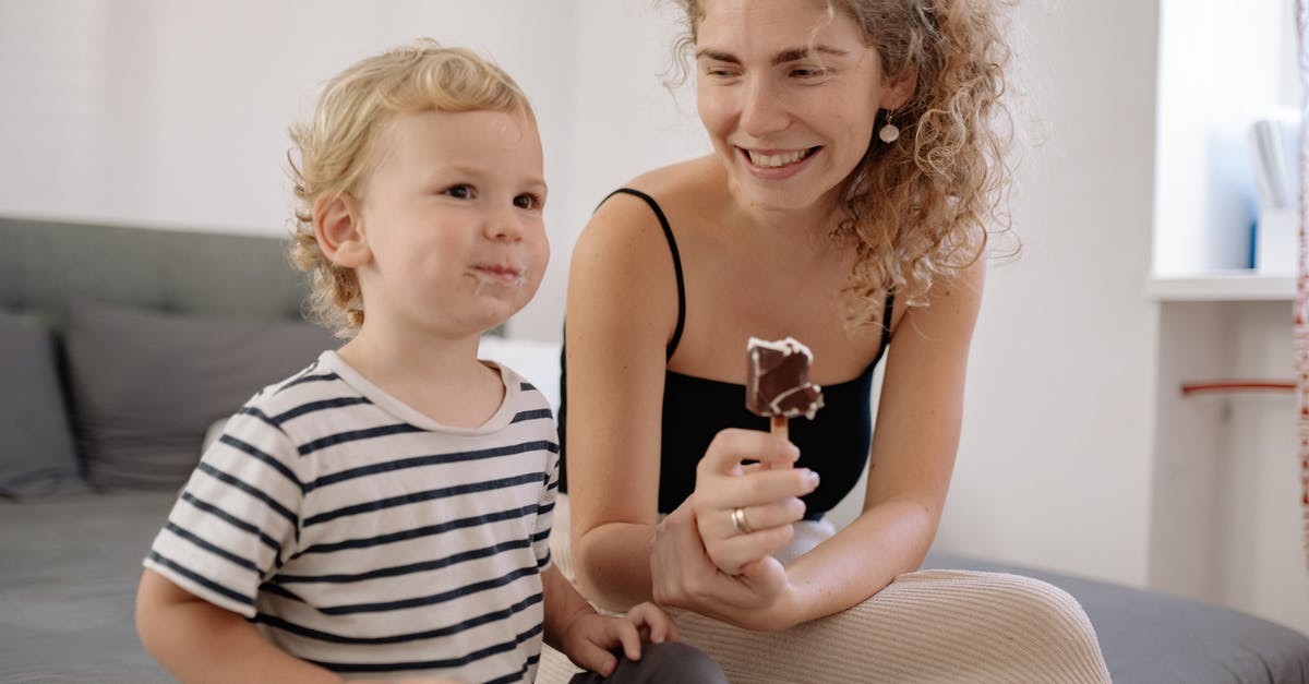 EEA family permit visa - Mother Smiling And Looking At Son EEA family permit visa - Mother Smiling And Looking At Son