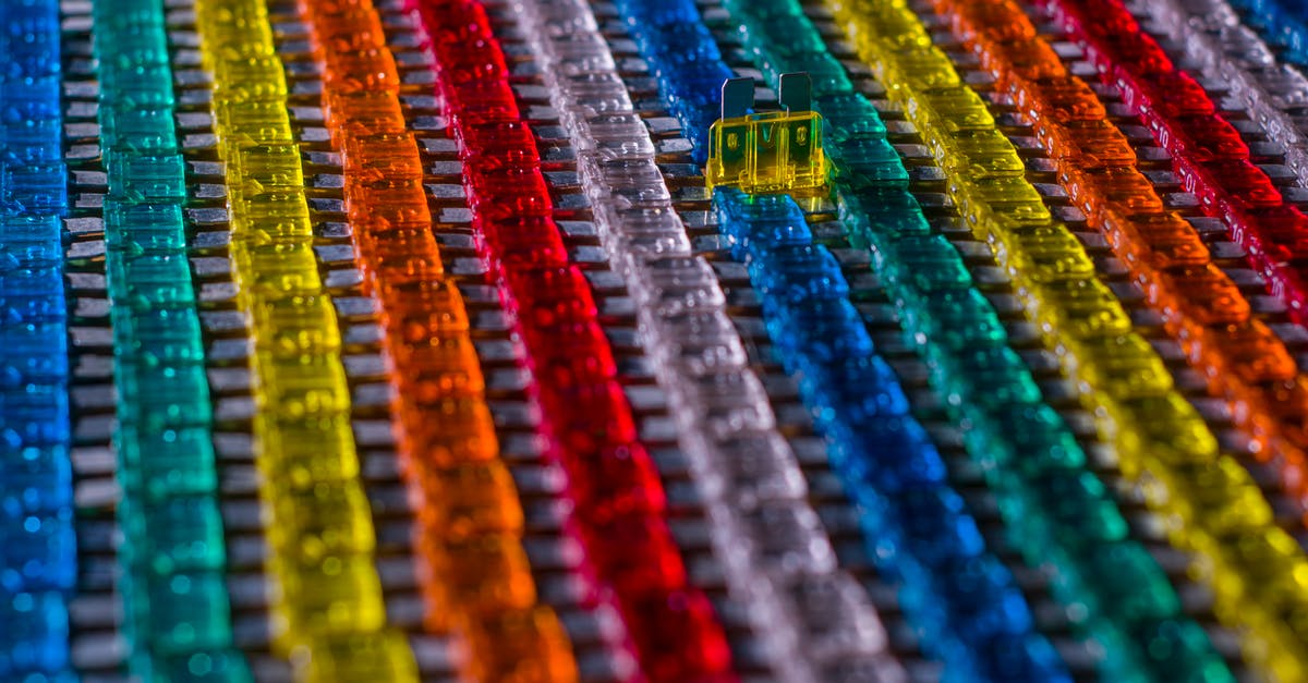 Electronic devices security on airplanes - Rows of multicolored car electrical fuses Electronic devices security on airplanes - Rows of multicolored car electrical fuses