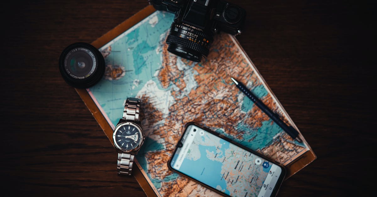 Electronic Map with Lodging pricing - Smartphone Beside Watch and Camera Electronic Map with Lodging pricing - Smartphone Beside Watch and Camera