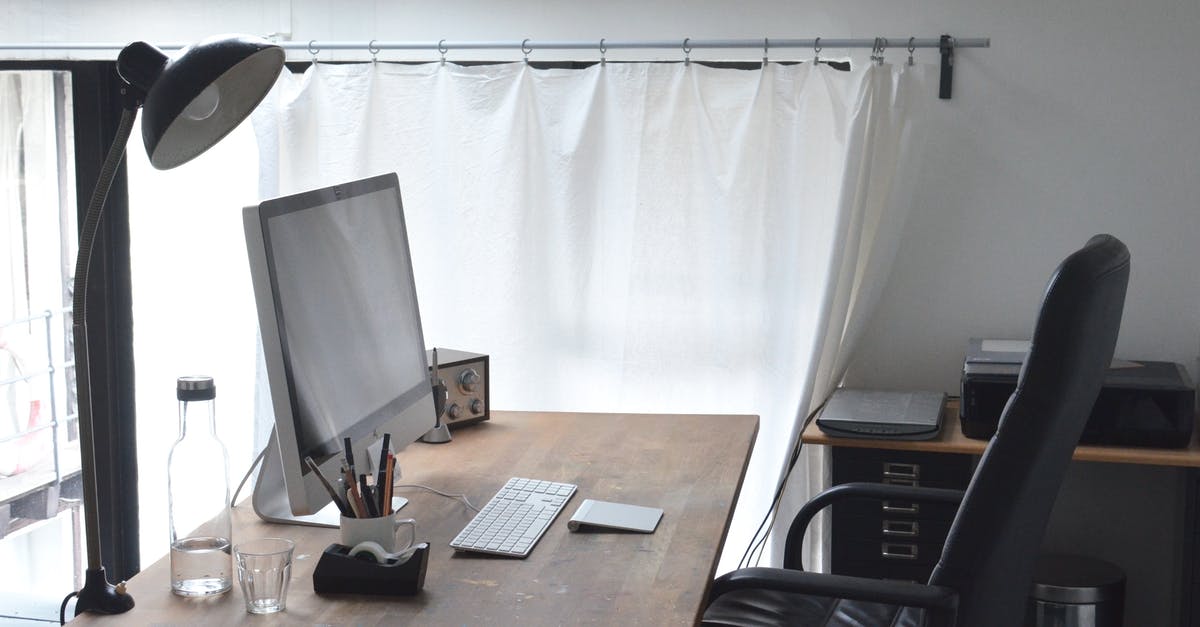 Electronic ticket with no printer - Workspace with computer and lamp composed with radio and stationery Electronic ticket with no printer - Workspace with computer and lamp composed with radio and stationery